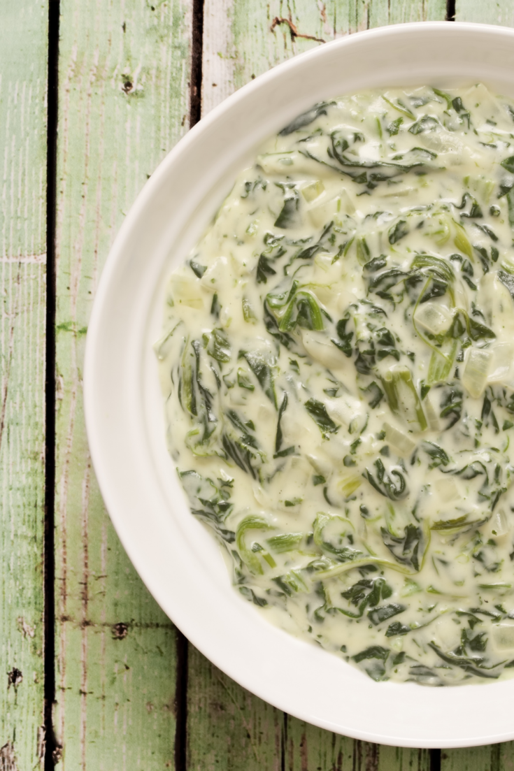 steakhouse creamed spinach in a white bowl