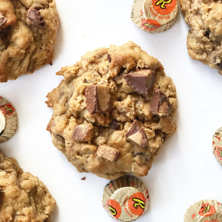 peanut butter oatmeal cookie with reeses candy on a white board