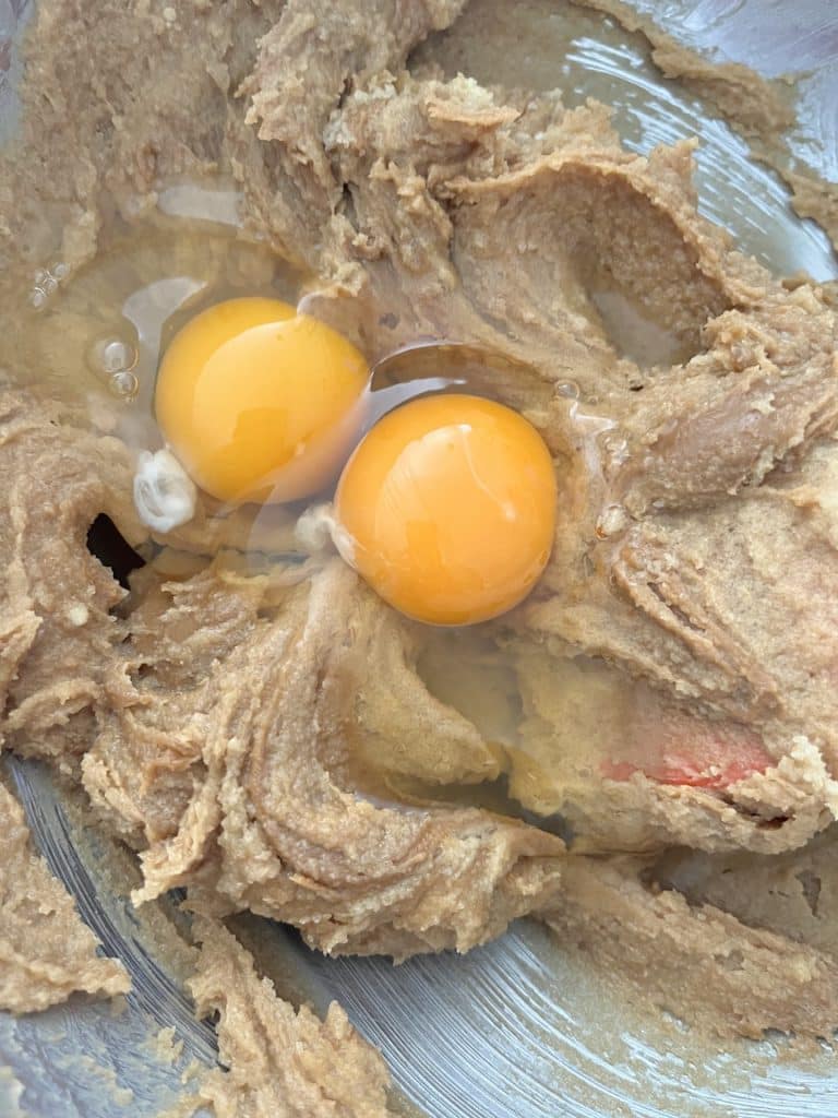 adding the eggs to the dough